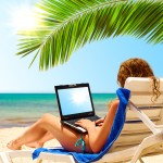 Women Entrepreneur on Beach with Laptop