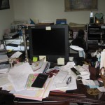Cluttered office before decluttering